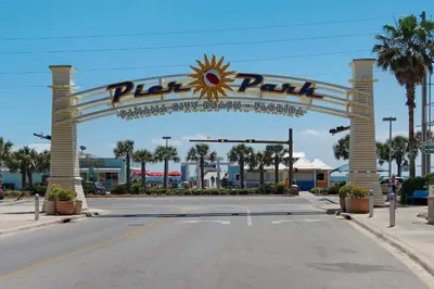 a sign for a parking lot at a theme park at Shores of Panama 1408 - Seaside Getaway in Panama City Beach