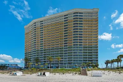 a tall building on the beach next to the beach at Boardwalk 2005 in Panama City Beach