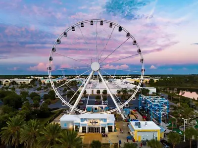 a ferris wheel at an amusement park at dusk at Tidewater 100 in Panama City Beach