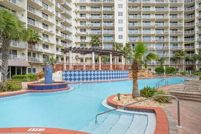 a large swimming pool in front of a large apartment building at Shores Of Panama #1509 in Panama City Beach