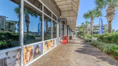 a building with movie posters on the side of it at Laketown Wharf #319 by Nautical Properties in Panama City Beach