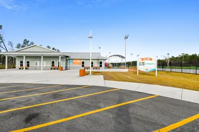 a parking lot in front of a building at Moonspinner #715A By Book That Condo in Panama City Beach