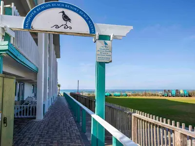 a sign outside of a building with a bird on it at Horizon South 83d in Panama City Beach