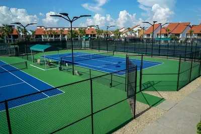 a group of tennis courts on a tennis court at Edgewater Villa #2607 in Panama City Beach