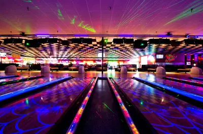 a brightly lit bowling alley with lanes and lights at Edgewater 1-0502 'Island Paradise' in Panama City Beach