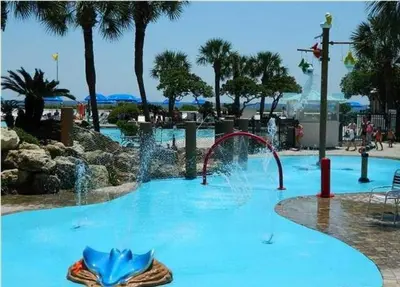 a swimming pool with a water park with a fountain at Edgewater 2-1202 'Shore Fun Penthouse' in Panama City Beach