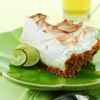 a slice of lime cake on a green plate at Sunbird 0405E 'No Worries' in Panama City Beach