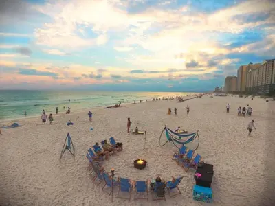 a group of people on a beach with the ocean at Laketown Wharf 816 'Tasty Waves PCB' in Panama City Beach