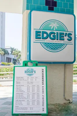 a sign for an eddies restaurant on the side of a building at Edgewater 3-1010 'The Salty Coconut' in Panama City Beach