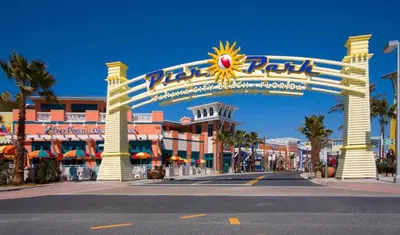 a large entrance to a resort with a sign at Top Of The Gulf 312 'The Tip-Sea Turtle' in Panama City Beach