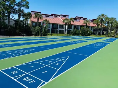 a tennis court in front of a building at Edgewater Villa 2809 'Shore 'Nuff' in Panama City Beach