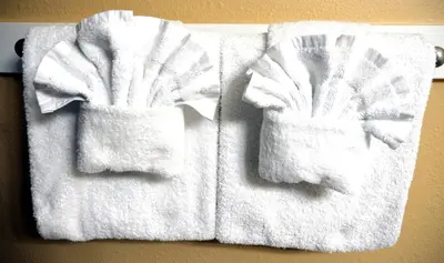 two towels are hanging on a wall at Edgewater Villa 0103 'The Lily Pad' in Panama City Beach