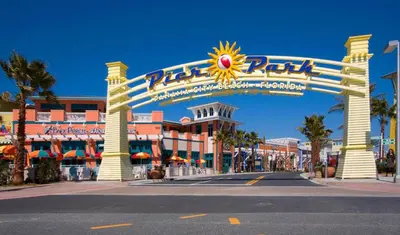 an entrance to a resort with a large sign at Sunbird 1104E 'Flamingo Palms' in Panama City Beach