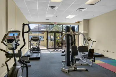 a gym with treadmills and cardio machines in a room at Sunbird 807E in Panama City Beach