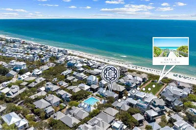 an aerial view of a city with a sign and the ocean at Abba Carriage House in Rosemary Beach