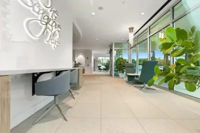 an office with chairs and tables and windows at One Seagrove Place 1001 in Santa Rosa Beach