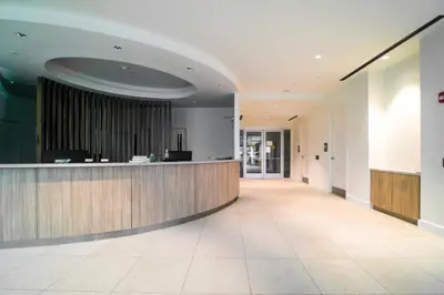 a lobby with a reception desk in a building at One Seagrove Place 0402 in Santa Rosa Beach