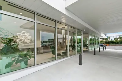 a large glass building with a lot of windows at One Seagrove Place 1603 in Santa Rosa Beach