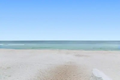 a sandy beach with the ocean in the background at One Seagrove Place 1703 in Santa Rosa Beach