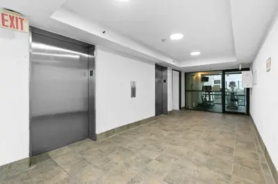 an empty hallway with a elevator in a building at One Seagrove Place 0408 in Santa Rosa Beach