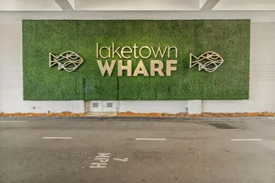 a sign on the side of a building with the words lockdown what at Laketown Wharf #1433 in Panama City Beach