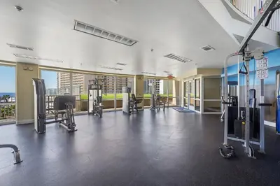 a gym with cardio equipment in a building at Laketown Wharf #0628 in Panama City Beach