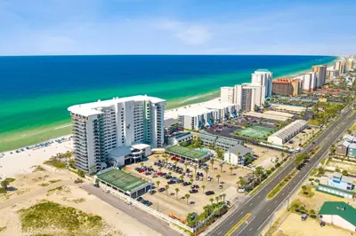an aerial view of a beach with buildings and the ocean at Watercrest 906 | Sand, Sea & Serenity in Panama City Beach