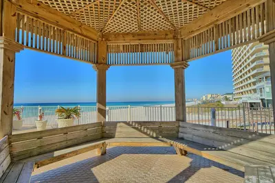 a wooden pavilion with a view of the beach at Treasure Island 1910 in Panama City Beach