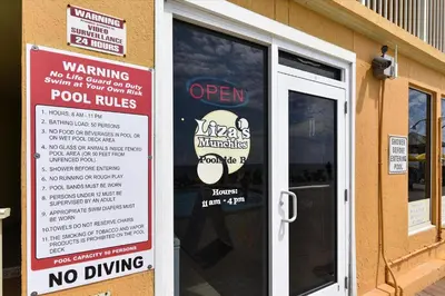 a sign on the door of a restaurant with a no driving sign at Treasure Island 1510 in Panama City Beach