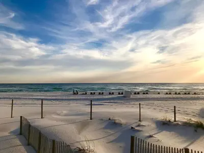a beach with snow on the sand and the ocean at Pelican Walk 309 in Panama City Beach