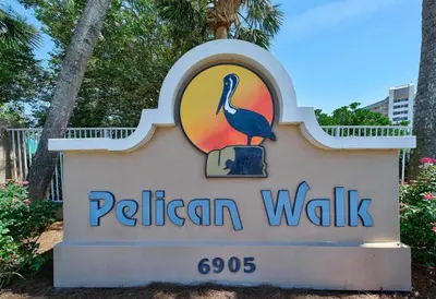 a sign for a pelican walk sign at Pelican Walk 403 in Panama City Beach