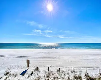 a sandy beach with the ocean in the background at Pelican Walk 211 in Panama City Beach