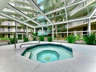 a swimming pool in the middle of a building at Pelican Walk 104 in Panama City Beach