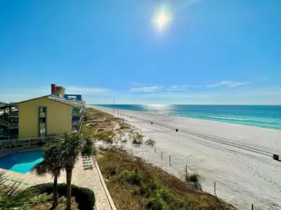 a view of a beach with a house and the ocean at Pelican Walk 406 in Panama City Beach