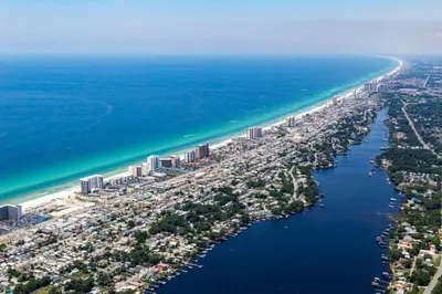 an aerial view of a city next to the ocean at Pelican Walk 704 in Panama City Beach
