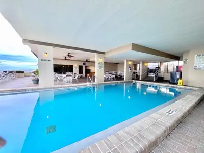 a large pool with blue water in a hotel at Gulfgate 301 in Panama City Beach