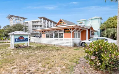 a house with a sign in front of a building at Palms of Seagrove A8 by Oversee 30A in Santa Rosa Beach