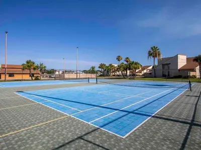 a tennis court with a person standing on it at Horizon South #76E in Panama City Beach