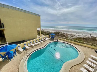 an overhead view of a swimming pool and the beach at Continental #221 in Panama City Beach