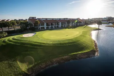 an aerial view of a golf course with a lake at Edgewater Villa #2008 Gulf Breeze Getaway in Panama City Beach