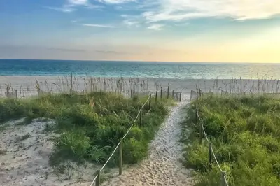 a path to the beach with the ocean in the background at Sand Castles West B28 (1/1) in Panama City Beach