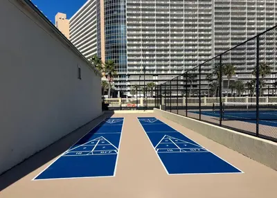 an empty basketball court in a city with tall buildings at Sunbird Resort! Stunning Remodeled Beachfront Condo! Free Beach Chair Service! by Dolce Vita PCB! in Panama City Beach