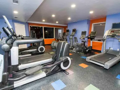 a gym with several treadmills and elliptical machines at Shores of Panama #109 in Panama City Beach