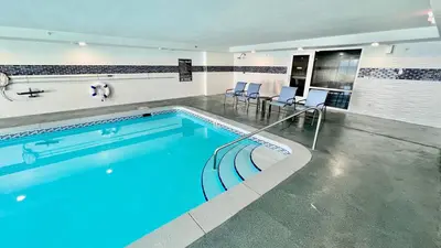 a swimming pool with blue water in a building at Ocean Reef 804 in Panama City Beach