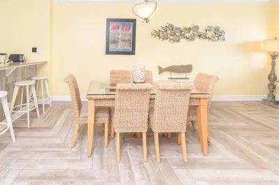 a dining room with a table and chairs at Sugar Shores OR in Panama City Beach
