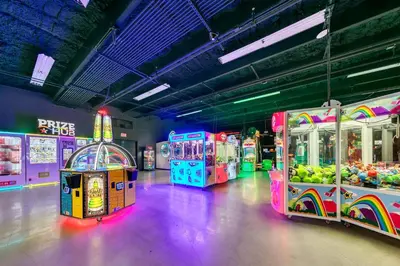 a row of arcade games in a room at Laketown Wharf 2135 in Panama City Beach