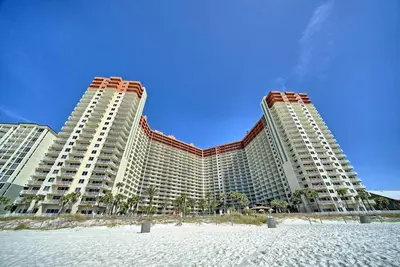 a resort with two tall buildings on the beach at Pineapple Paradise, Beach Front, Newly Renovated, Sleeps 6 in Panama City Beach