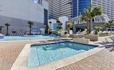 a swimming pool in the middle of a building at Modern Resort Condo! Gulf Views & Amenities Galore! presented by Dolce Vita Getaways! in Panama City Beach