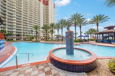 a pool at a resort with a large building at Shores Of Panama #1927 in Panama City Beach