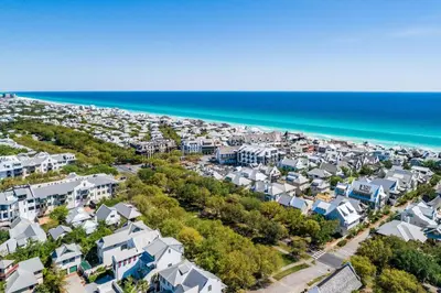an aerial view of a beach with houses and the ocean at Highland Carriage House in Rosemary Beach